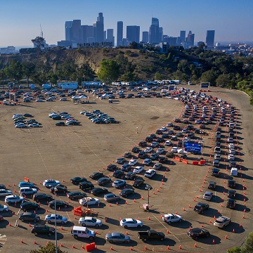 Climate Cancer: Cars in line for testing and jabbing.